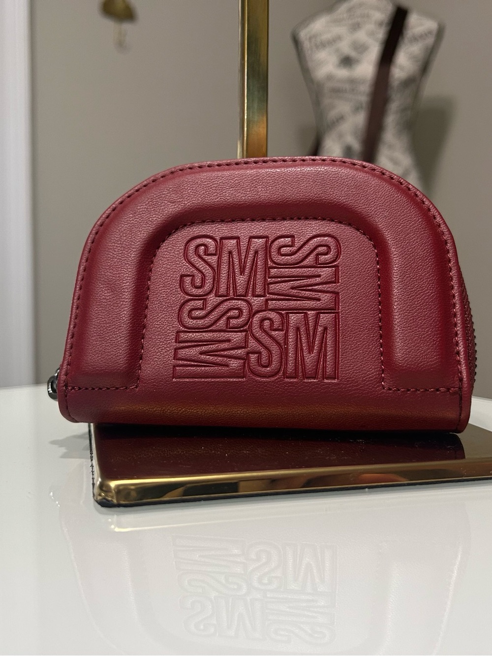 SM Embossed Half-Moon Crossbody Bag in Burgundy